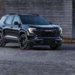 A black 2025 GMC Terrain from the front after leaving a GMC dealer near Marietta.