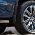 The tire of a blue 2025 GMC Sierra 1500 Denali.