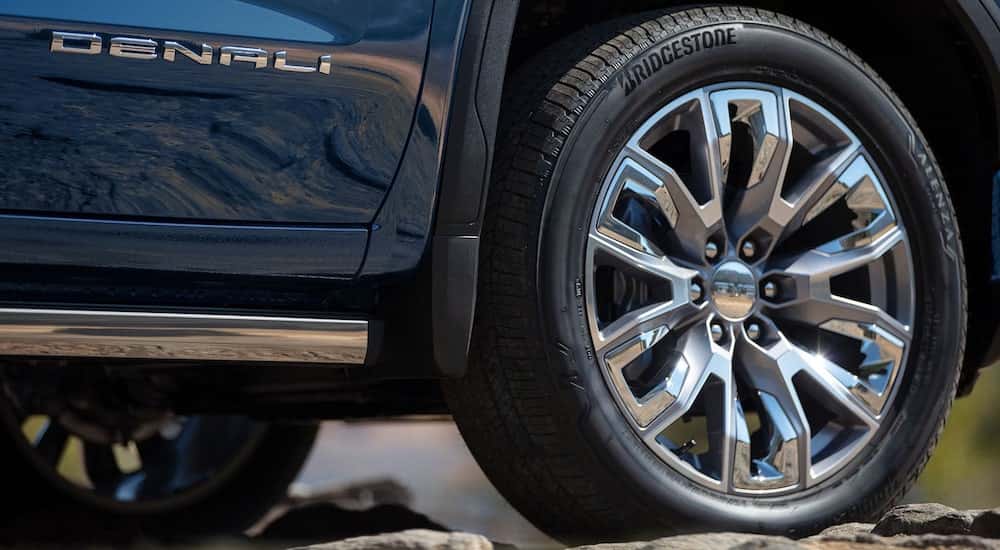 The tire of a blue 2025 GMC Sierra 1500 Denali.