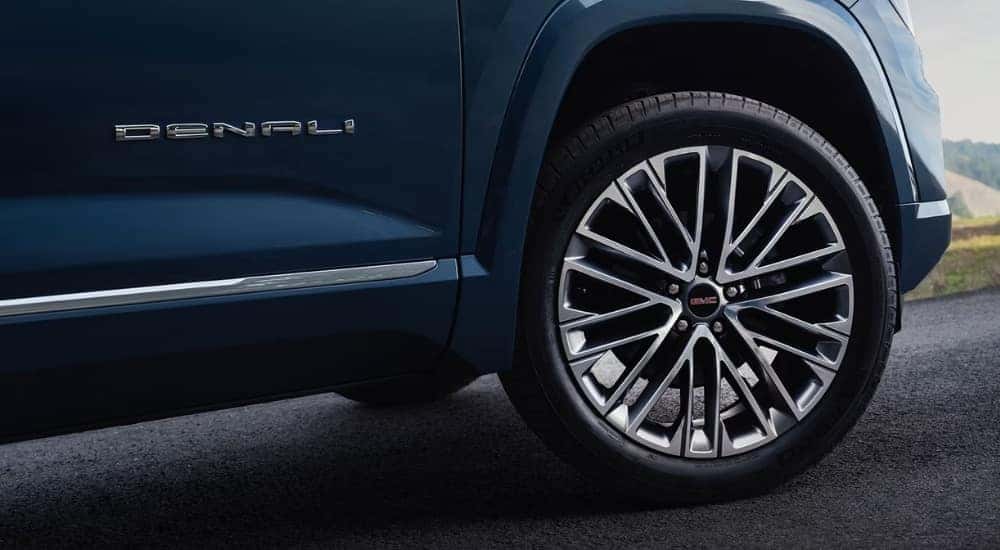 Front passenger side wheel on a blue 2026 GMC Terrain Denali.