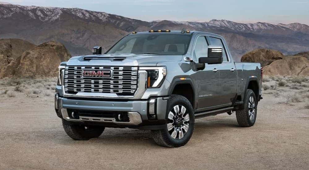 A silver 2025 Sierra 2500 HD parked off-road.