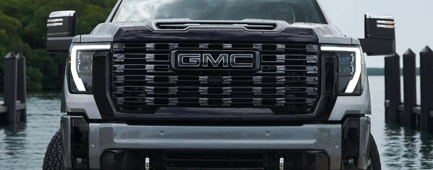 Headlights and grille on a grey 2025 GMC Sierra 2500 HD.