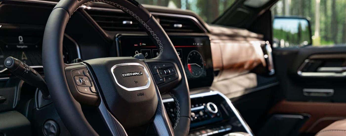 Close-up of the steering wheel in a 2025 GMC Sierra 1500.