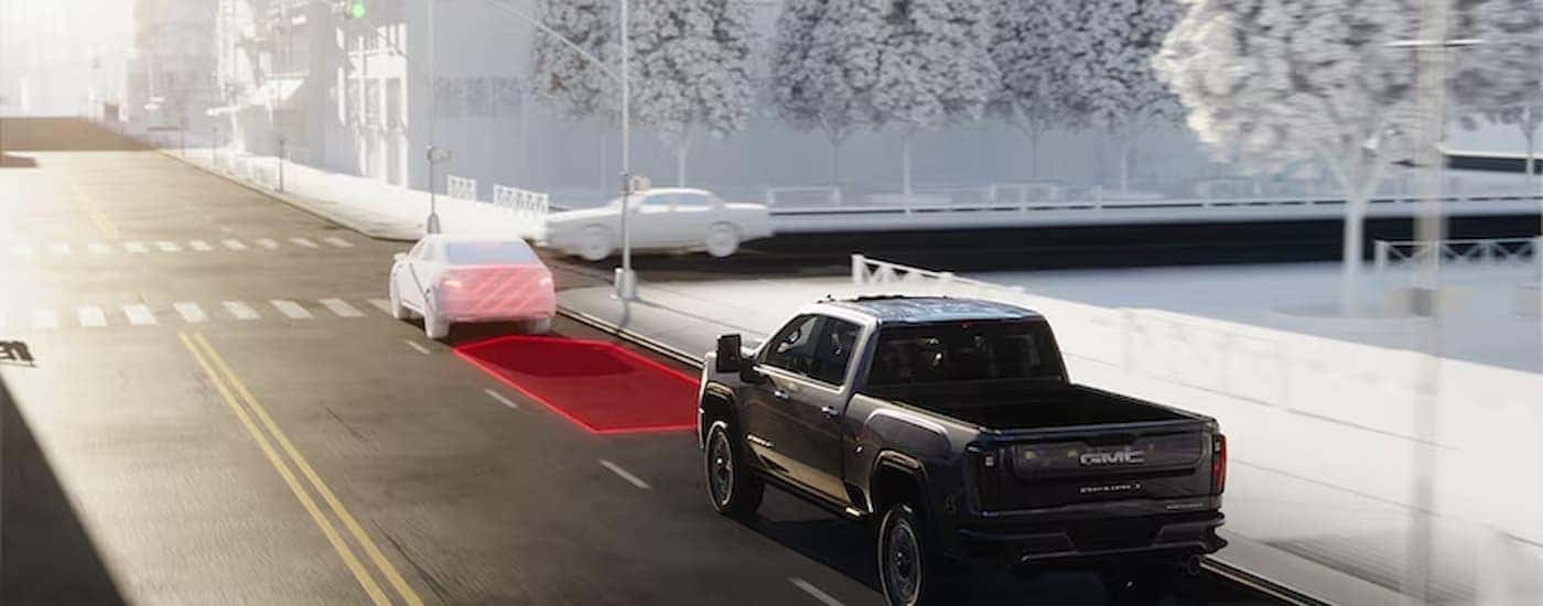 A mockup of how the Forward Collision Alert works on a black 2026 GMC Sierra 2500 HD