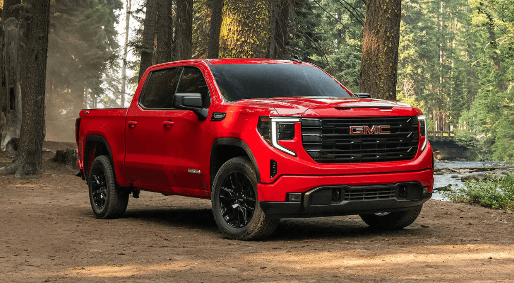 Red 2026 GMC Sierra 1500 Elevation parked off-road