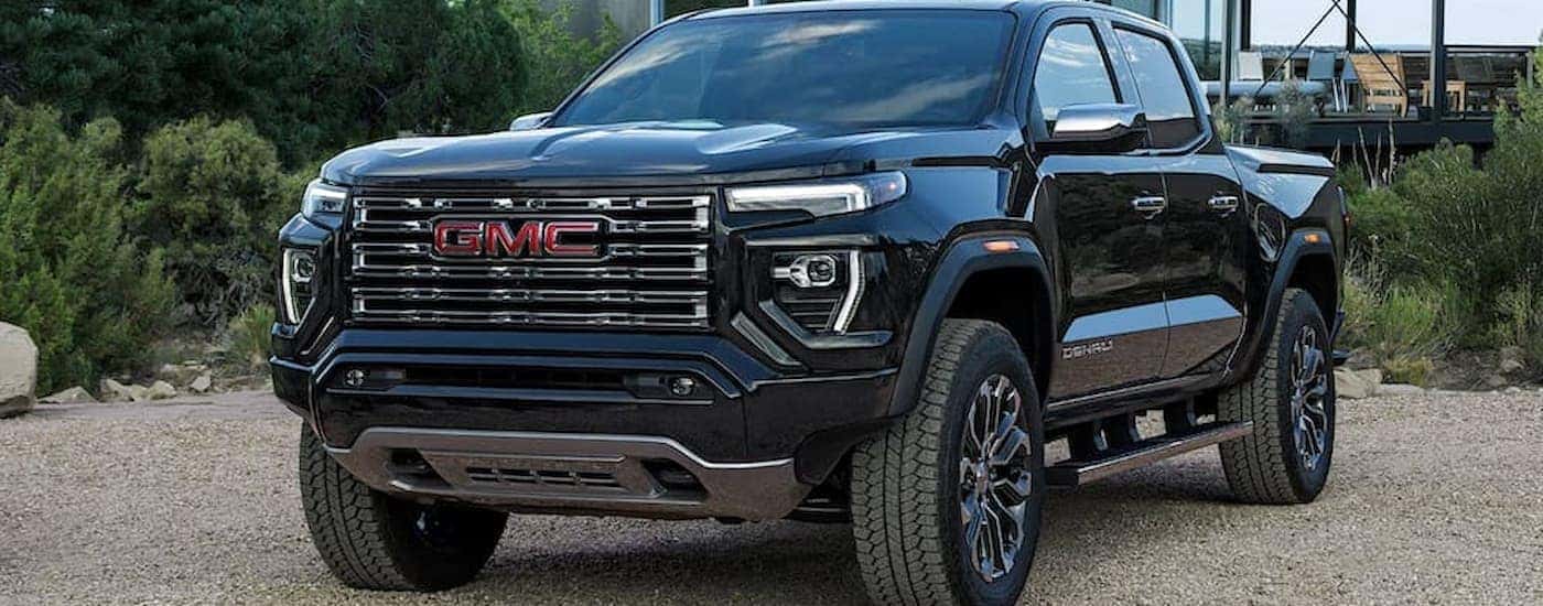 A black 2026 GMC Canyon parked for sale