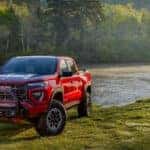 A red 2026 GMC Canyon from the front.