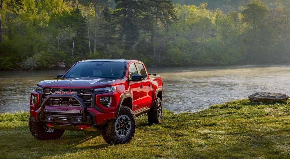A red 2026 GMC Canyon from the front.