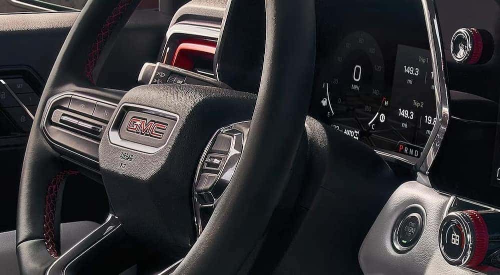 Close-up of a steering wheel in a 2026 GMC Canyon for sale.