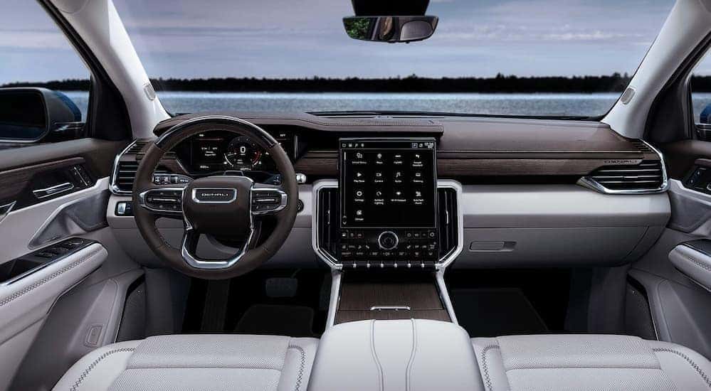 Gray and black interior and dash in a 2026 GMC Acadia.