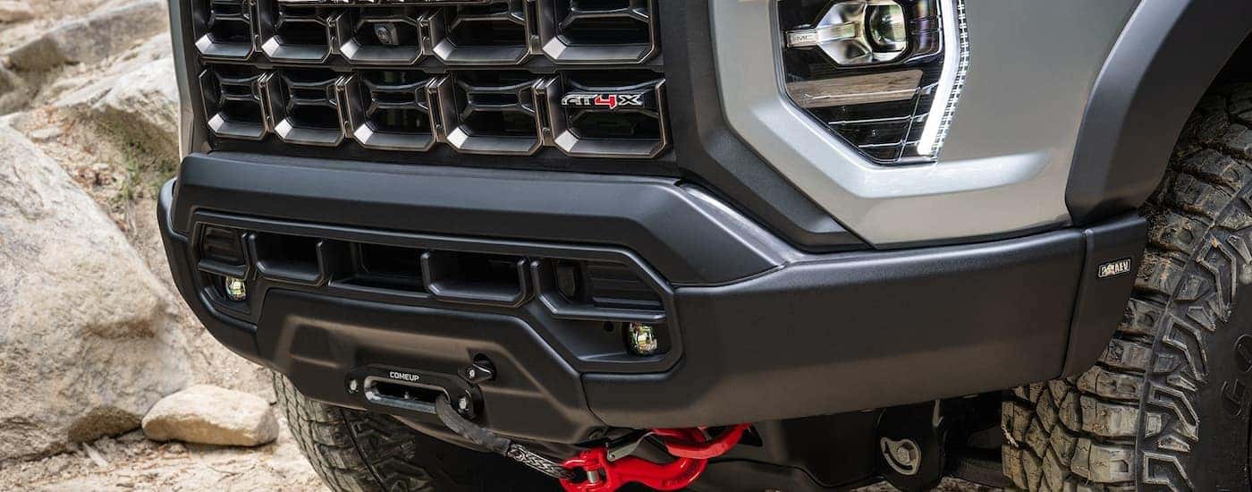 Grille and front of a silver 2026 GMC Canyon AT4X