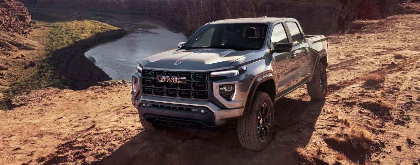 Silver 2024 GMC Canyon parked off-road