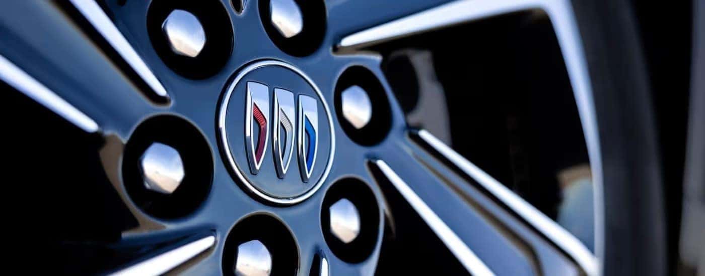 A close up shows the center cap on a 2025 Buick Enclave.