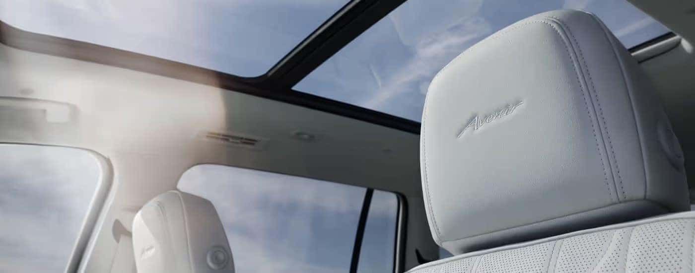 A close up shows the Avenir stitching on the headrest in a 2025 Buick Enclave.