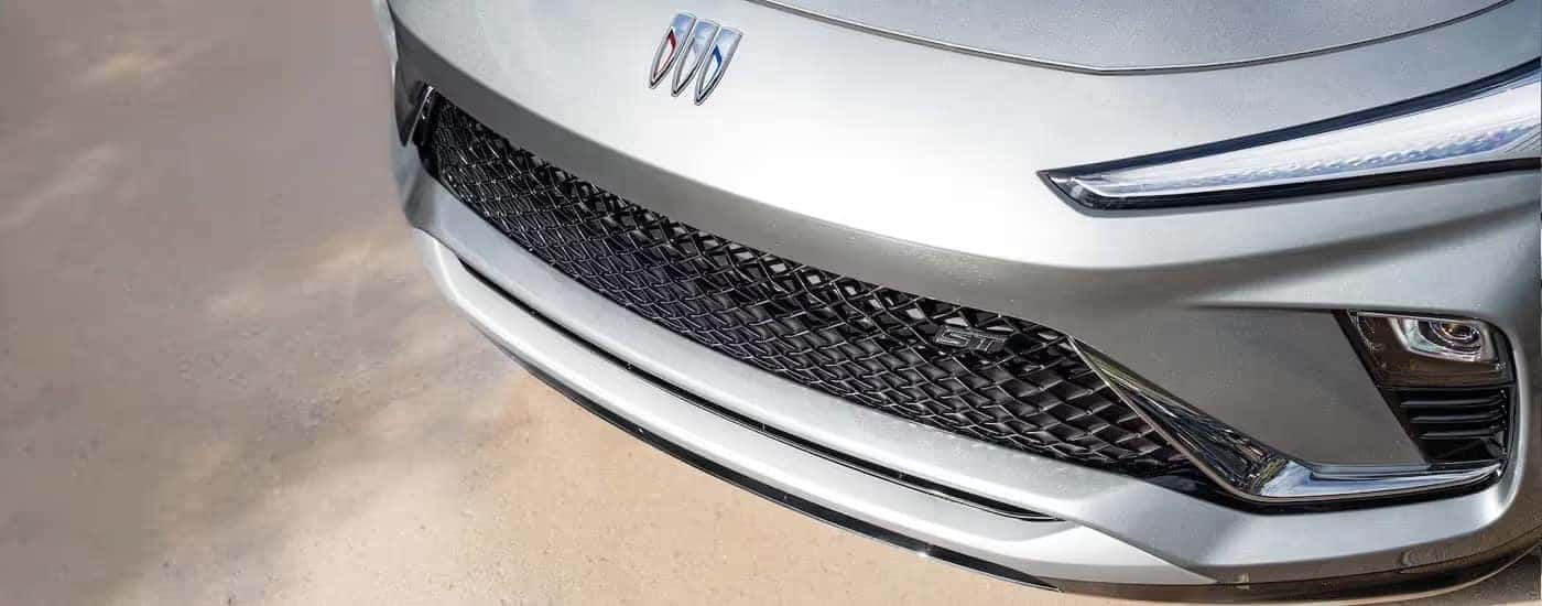 Close-up of the hood and grille of a silver 2025 Buick Envista ST.