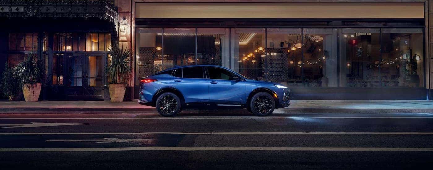 Blue 2026 Buick Envista driving at night.