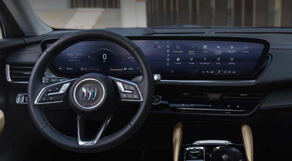 Interior view of a 2026 Buick Envision infotainment, steering wheel & digital gauge cluster.