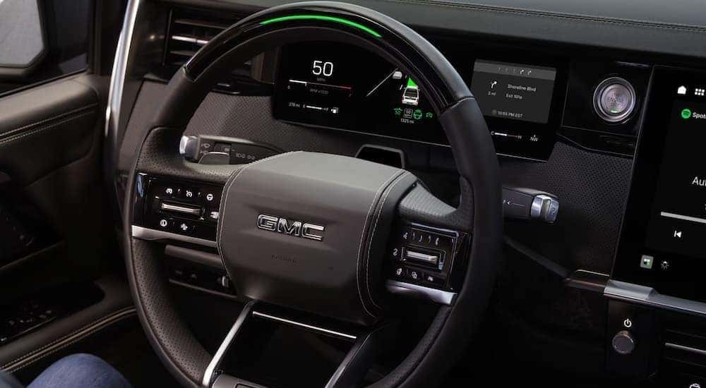 Black steering wheel in a 2027 GMC Sierra 1500.