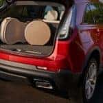 Cargo is shown in the trunk of a red 2023 Cadillac XT4.