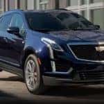 A blue 2023 Cadillac XT5 is shown parked after visiting a used Cadillac dealer near Duluth, GA.