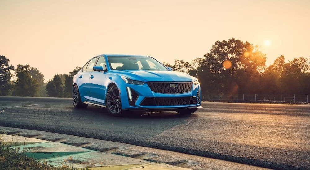 A blue 2023 Cadillac CT5-V Blackwing is shown from the front at an angle.