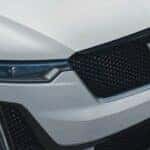 A close up shows the grille on a white 2024 Cadillac XT6.