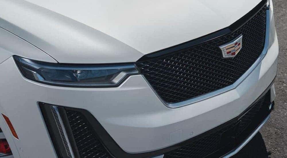 A close up shows the grille on a white 2024 Cadillac XT6.