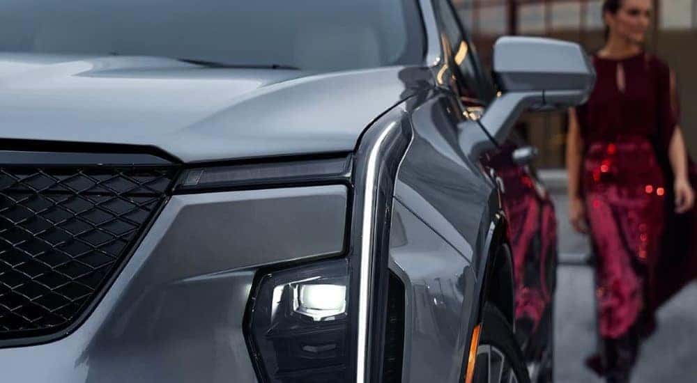 A close up shows the driver side headlight on a silver 2024 Cadillac XT4 after leaving a Cadillac dealer near Sandy Springs, GA.