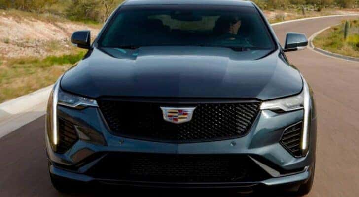 A blue 2021 Cadillac CT4-V is shown from the front.