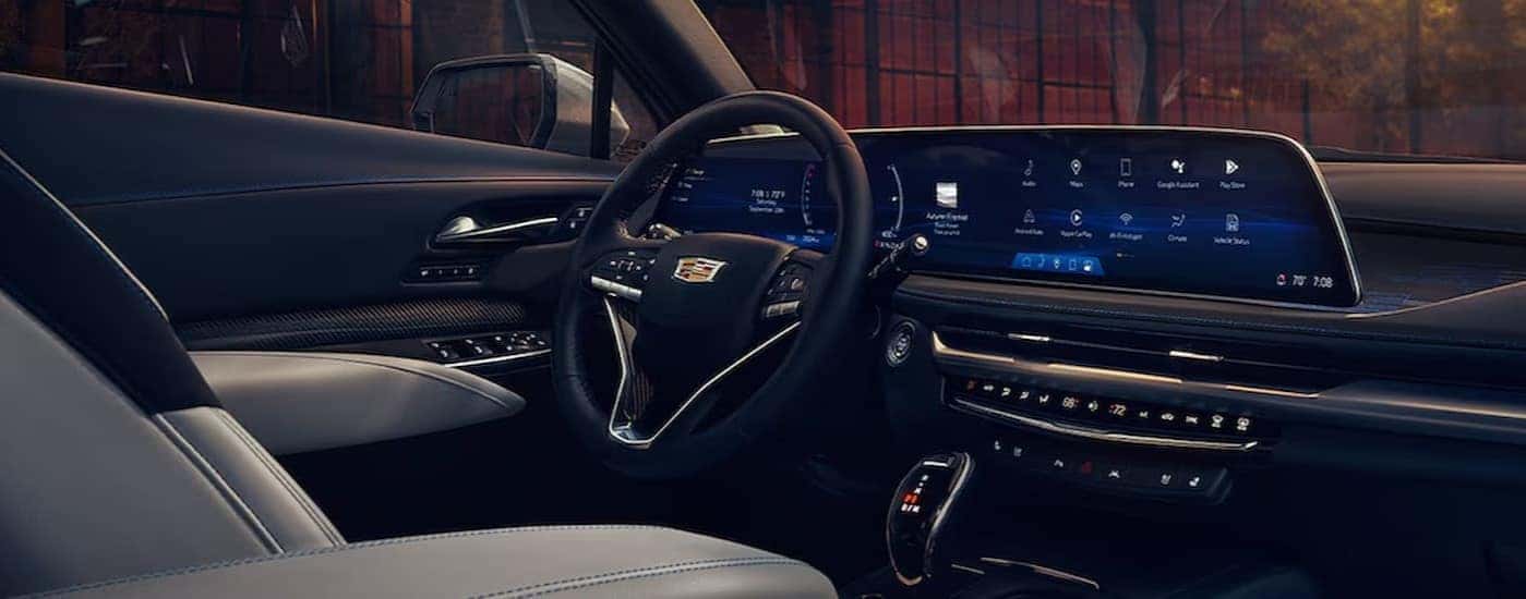 The gray and black interior and dash in a 2024 Cadillac XT4 is shown.