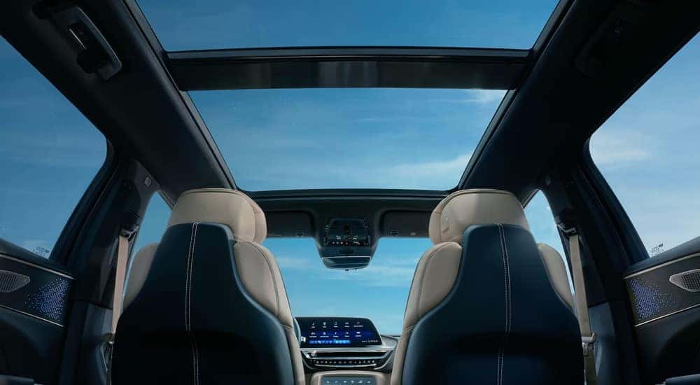 The moonroof and front seats in a 2024 Cadillac LYRIQ Sport.