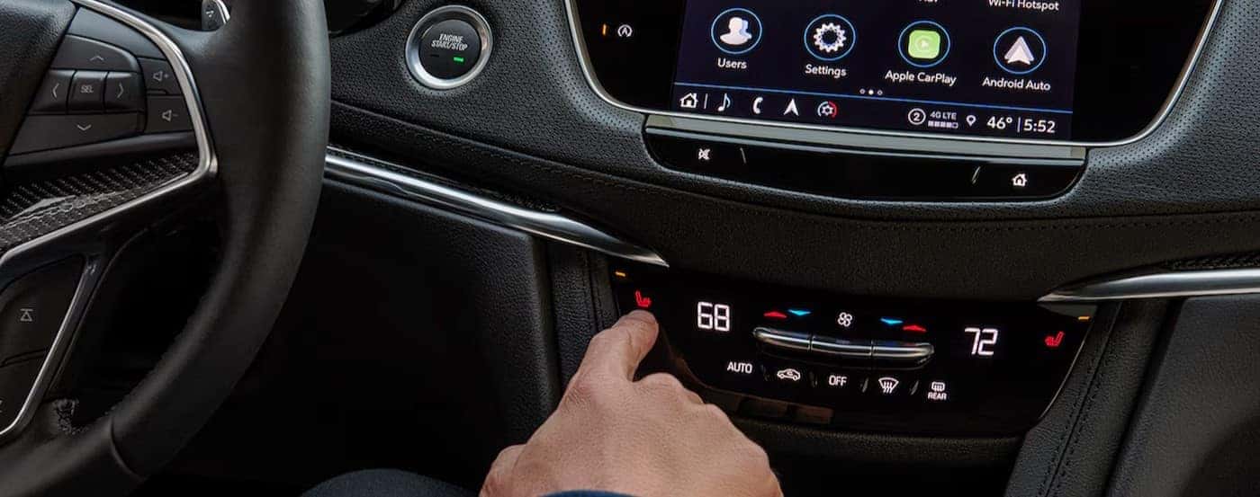 The technology on a black dash is shown in a 2024 Cadillac XT5.