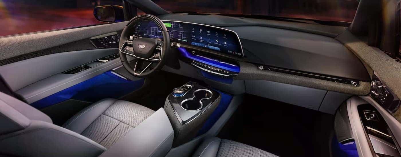 The gray and blue interior and dash in a 2025 Cadillac OPTIQ is shown.