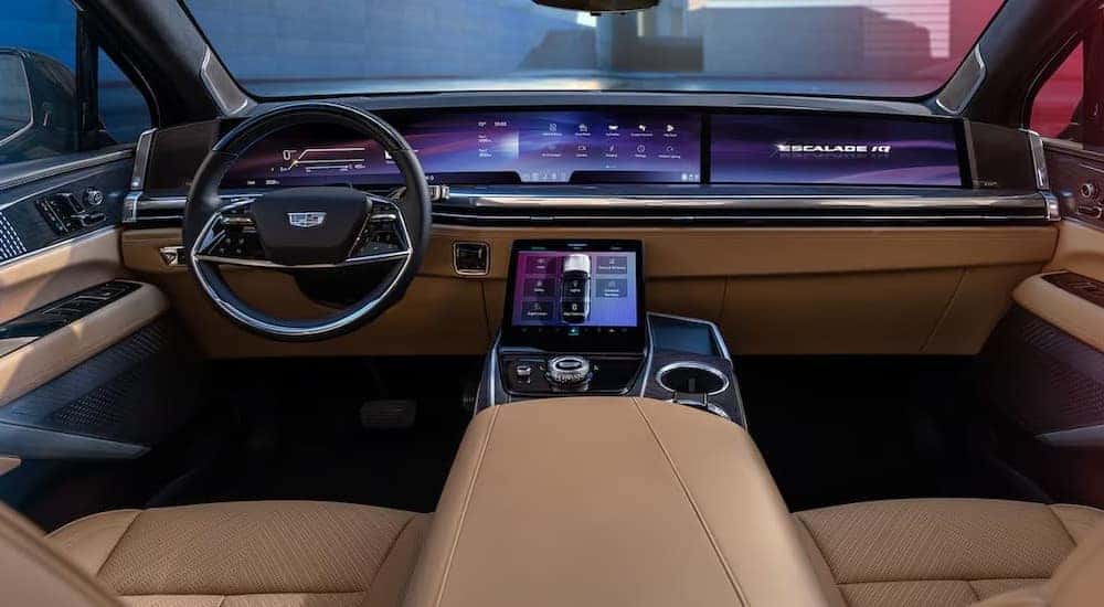 The black and brown interior and dash in a 2025 Cadillac Escalade IQ is shown.