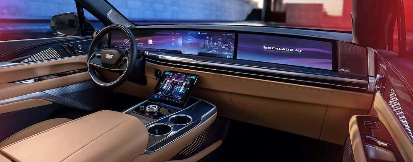 The tan interior and dash in a 2025 Cadillac Escalade IQ is shown.