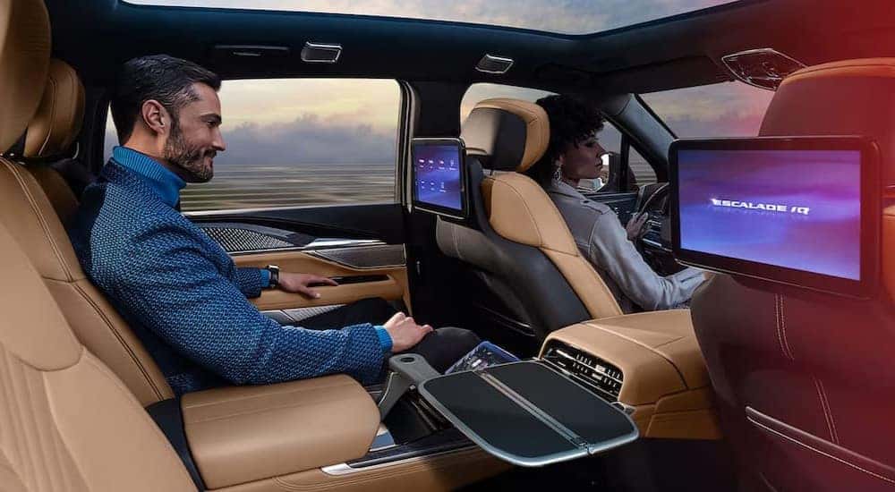 The black and brown rear interior in a 2025 Cadillac Escalade IQ is shown.