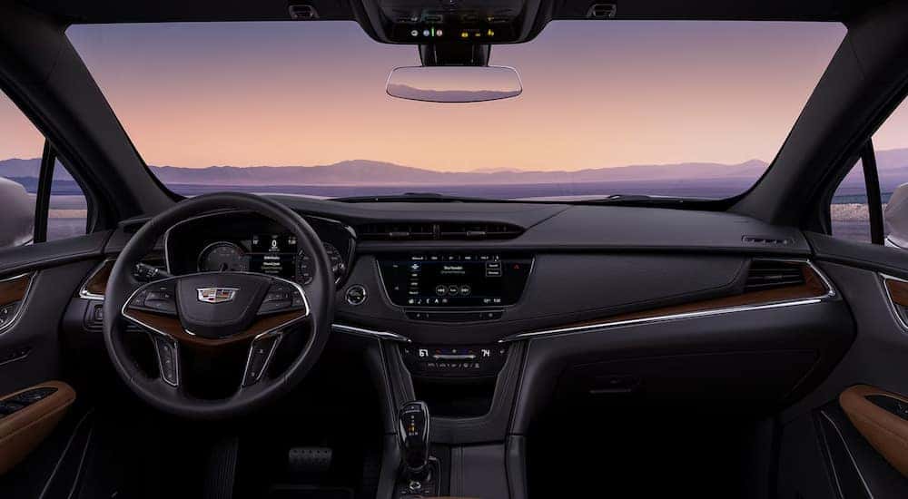 The cabin and dashboard in a 2025 Cadillac XT5 for sale.