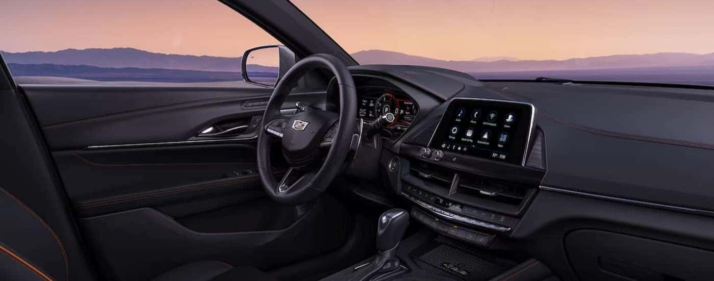 The black interior and dash in a 2025 Cadillac CT4 is shown.