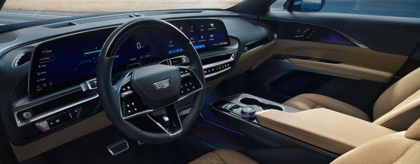 The black and tan interior and dash in a 2025 Cadillac LYRIQ is shown.