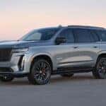 A silver 2024 Cadillac Escalade V Series is shown from the side.