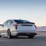 A white 2022 Cadillac CT5-V Blackwing is shown from the rear at an angle after leaving a dealer that has a used Cadillac for sale.