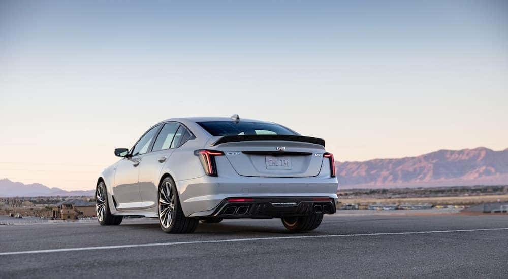 A white 2022 Cadillac CT5-V Blackwing is shown from the rear at an angle after leaving a dealer that has a used Cadillac for sale.