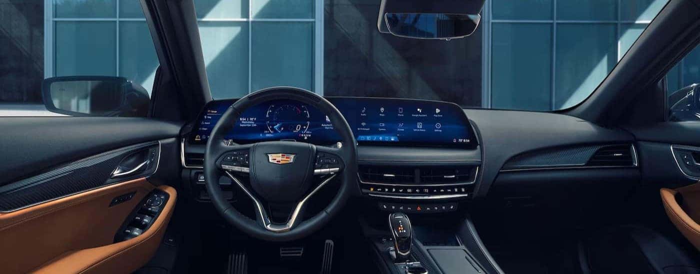 The black and tan interior and dash are shown in a 2025 Cadillac CT5.