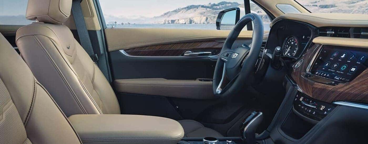 The tan leather interior is shown in a 2025 Cadillac XT6.