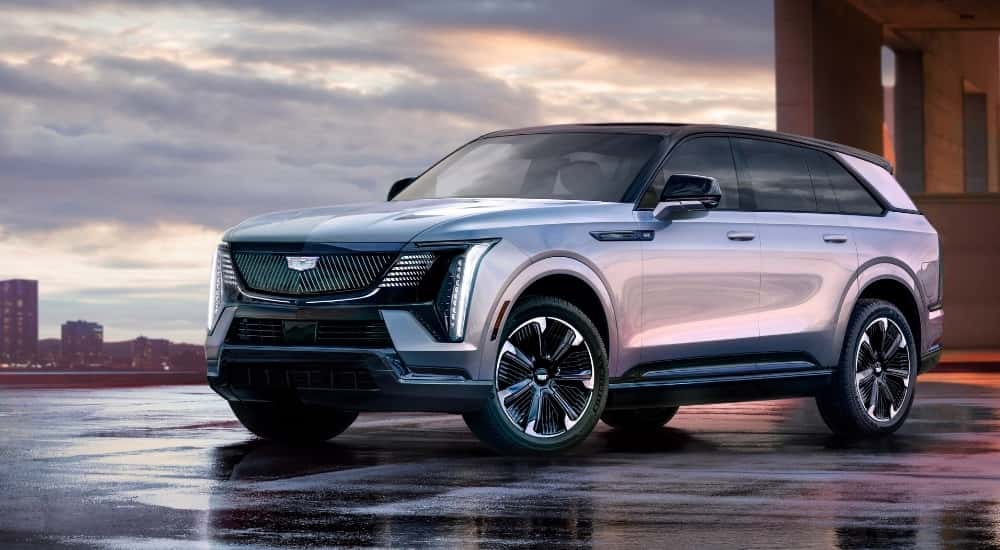 A white 2025 Cadillac Escalade IQ is shown form the side.