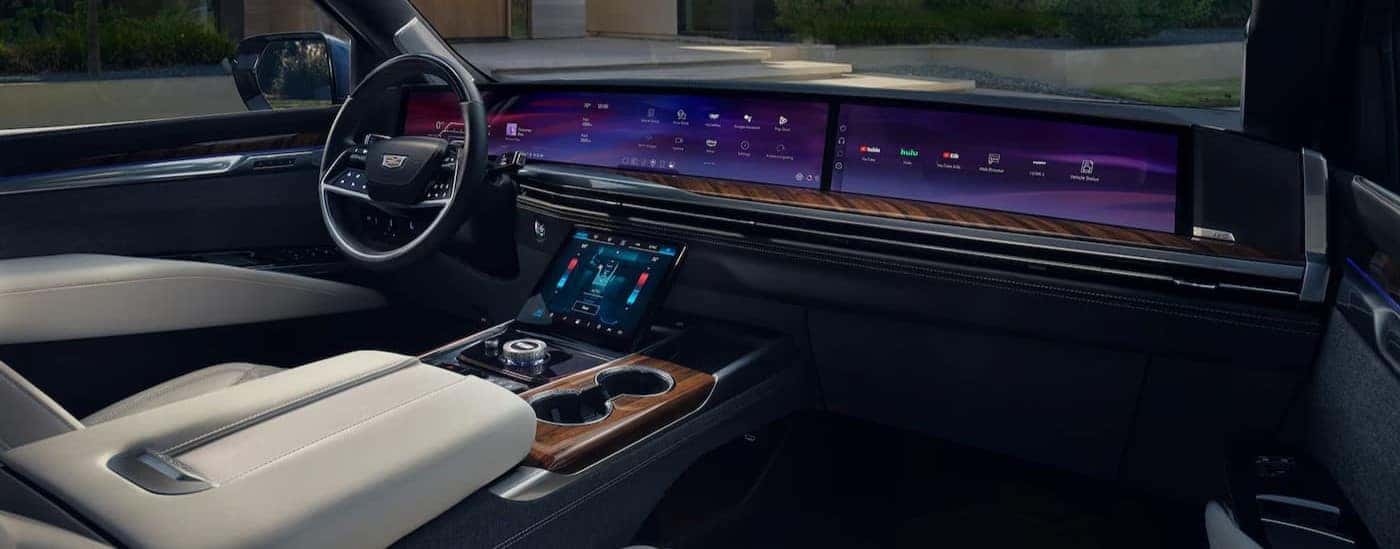 The black and white interior and dash are shown in a 2025 Cadillac Escalade for sale near Marietta.