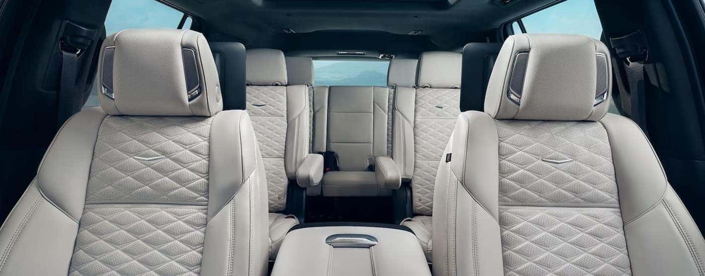 The black and white interior is shown in a 2025 Cadillac Escalade.
