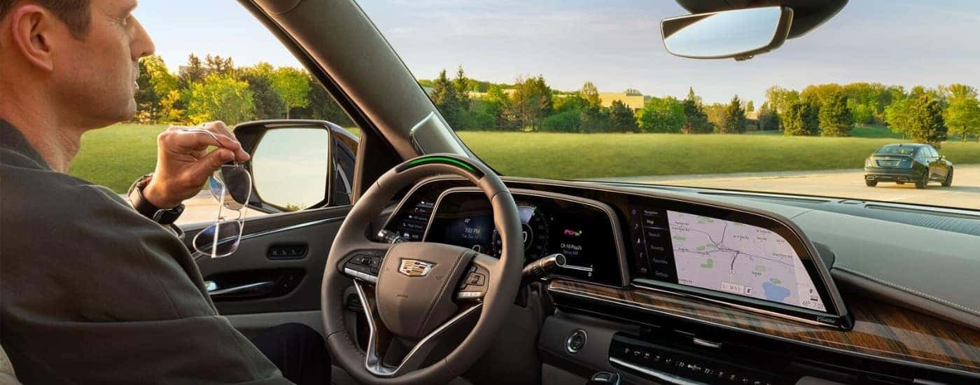 A person is using the SuperCruise feature in a 2024 Cadillac Escalade.