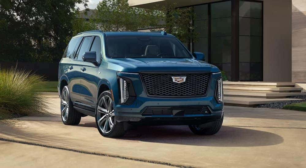 A parked blue 2025 Cadillac Escalade for sale near Chamblee.