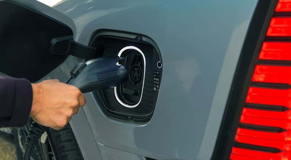 Close-up of the charging port in a blue 2026 Cadillac Escalade IQL.